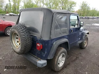 2002 Jeep Wrangler X z VIN 1J4FA39S32P767598, wystawiony jako Copart lot #55974555 z przebiegiem 177 793 mil mil oraz Czysty tytuł • Clean title. Historia ofert i sprzedaży dostępna na DreamBid. Obrazek 3.