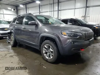2019 Jeep Cherokee Trailhawk Elite with VIN 1C4PJMBNXKD182846, listed as a Copart auction lot 84090984 with 79,212 mi miles and Salvage title. Bid and sale history available at DreamBid. Image 4.