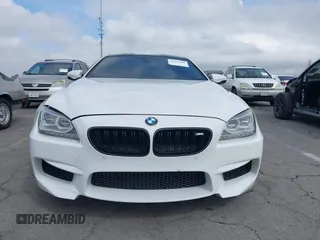 2013 BMW M6 z VIN WBSLX9C50DC968892, wystawiony jako IAAI lot #41935486 z przebiegiem 105 736 mil mil oraz . Historia ofert i sprzedaży dostępna na DreamBid. Obrazek 6.