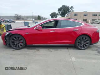 2015 Tesla Model S 85D with VIN 5YJSA1H42FF086599, listed as a IAAI auction lot 41832223 with 67,671 mi miles. Bid and sale history available at carsss.com. Image 14.