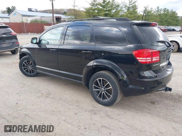 2018 Dodge Journey SE with VIN 3C4PDCAB1JT446005, listed as a IAAI auction lot 42001854 with 70,074 mi miles and . Bid and sale history available at DreamBid. Image 3.
