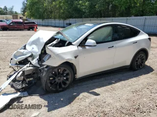 2023 Tesla Model Y Long Range z VIN 7SAYGDEE8PF748262, wystawiony jako Copart lot #54978325 z przebiegiem Nie podano mil oraz Szkoda całkowita • Salvage title. Historia ofert i sprzedaży dostępna na DreamBid. Obrazek 1.
