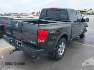 2010 Nissan Titan Pro-4X with VIN 1N6BA0EC9AN323943, listed as a IAAI auction lot 42795482 with 200,453 mi miles and . Bid and sale history available at DreamBid. Image 4.