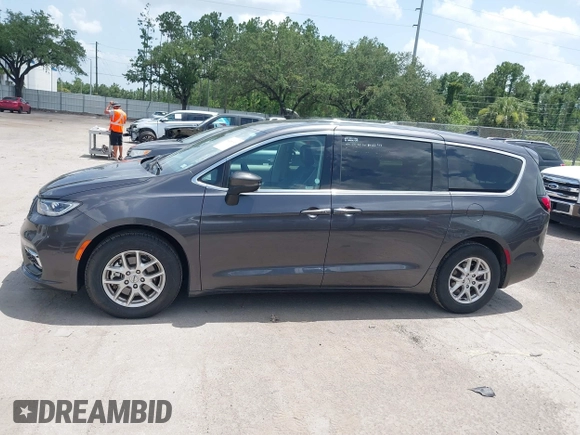 2023 Chrysler Pacifica Touring L with VIN 2C4RC1BG6PR590302, listed as a IAAI auction lot 42451369 with 72,097 mi miles and . Bid and sale history available at DreamBid. Image 14.