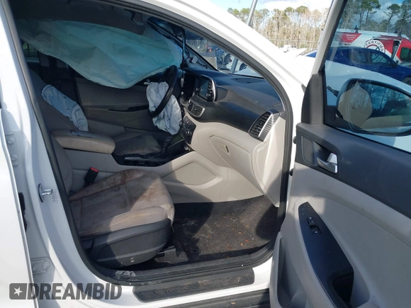 2019 Hyundai Tucson SE with VIN KM8J2CA48KU951829, listed as a IAAI auction lot 41261166 with 100,533 mi miles. Bid and sale history available at carsss.com. Image 5.