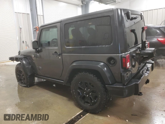 2017 Jeep Wrangler Willys Wheeler with VIN 1C4AJWAG9HL696710, listed as a Copart auction lot 88744905 with 66,800 mi miles and Salvage Title. Bid and sale history available at DreamBid. Image 2.