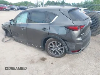 2018 Mazda CX-5 Grand Touring z VIN JM3KFADM5J1365772, wystawiony jako IAAI lot #42251805 z przebiegiem 44 599 mil mil oraz . Historia ofert i sprzedaży dostępna na DreamBid. Obrazek 3.