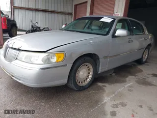 2002 Lincoln Town Car Executive with VIN 1LNHM81W42Y608998, listed as a IAAI auction lot 42096798 with 222,672 mi miles. Bid and sale history available at carsss.com. Image 2.