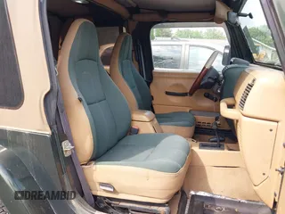 1998 Jeep Wrangler Sahara z VIN 1J4FY49SXWP716218, wystawiony jako IAAI lot #42354433 z przebiegiem 234 378 mil mil oraz . Historia ofert i sprzedaży dostępna na DreamBid. Obrazek 5.