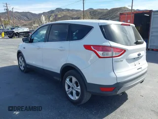 2014 Ford Escape SE with VIN 1FMCU9GX0EUD05633, listed as a IAAI auction lot 41582757 with 103,729 mi miles. Bid and sale history available at carsss.com. Image 3.