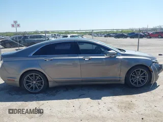 2014 Lincoln MKZ z VIN 3LN6L2G92ER835456, wystawiony jako IAAI lot #41985573 z przebiegiem 174 080 mil mil oraz . Historia ofert i sprzedaży dostępna na DreamBid. Obrazek 13.