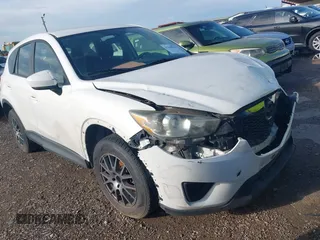 2014 Mazda CX-5 Sport z VIN JM3KE2BE9E0314758, wystawiony jako IAAI lot #42348939 z przebiegiem 143 677 mil mil oraz . Historia ofert i sprzedaży dostępna na DreamBid. Obrazek 1.