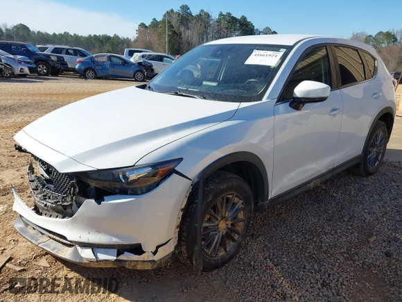 2019 Mazda CX-5 Sport with VIN JM3KFBBM0K0574255, listed as a IAAI auction lot 41661924 with 93,851 mi miles and . Bid and sale history available at DreamBid. Image 2.