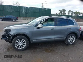 2013 Volkswagen Touareg Lux with VIN WVGEF9BPXDD000679, listed as a IAAI auction lot 41956471 with 117,465 mi miles and . Bid and sale history available at DreamBid. Image 14.