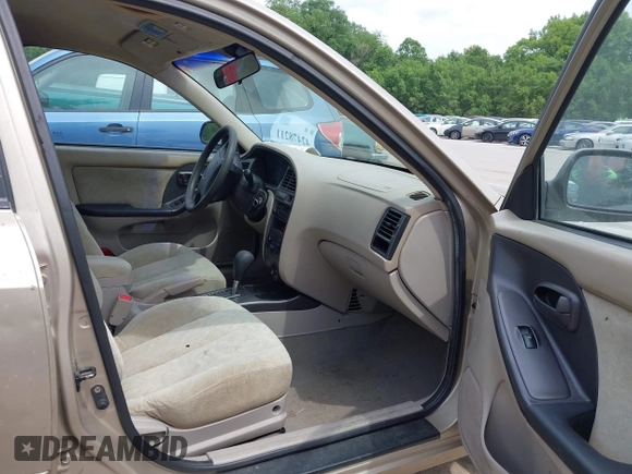 2003 Hyundai Elantra GLS z VIN KMHDN45D73U556305, wystawiony jako IAAI lot #42478211 z przebiegiem 149 648 mil mil oraz . Historia ofert i sprzedaży dostępna na DreamBid. Obrazek 5.