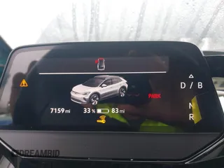2023 Volkswagen ID.4 Pro z VIN 1V2CMPE88PC028158, wystawiony jako IAAI lot #41538391 z przebiegiem 7159 mil mil oraz . Historia ofert i sprzedaży dostępna na DreamBid. Obrazek 7.