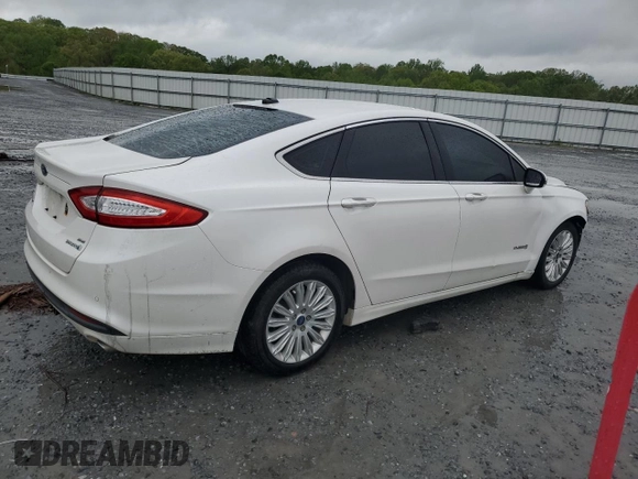 2013 Ford Fusion SE Hybrid with VIN 3FA6P0LU1DR358983, listed as a Copart auction lot 51907665 with 143,459 mi miles and Salvage Title. Bid and sale history available at DreamBid. Image 3.