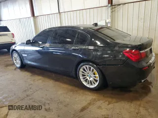 2014 BMW 7 Series ALPINA B7 xDrive with VIN WBAYF8C53ED652566, listed as a Copart auction lot 61177235 with 144,566 mi miles and Salvage title. Bid and sale history available at DreamBid. Image 2.