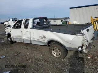1997 Ford F-150 XL with VIN 1FTDX1869VKA43999, listed as a Copart auction lot 42239815 with 145,238 mi miles and Salvage Title. Bid and sale history available at carsss.com. Image 2.