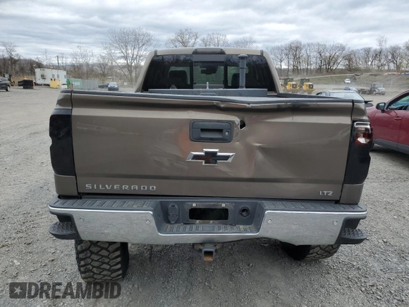 2014 Chevrolet Silverado 1500 LTZ with VIN 1GCVKSEC0EZ140325, listed as a Copart auction lot 52954845 with 128,231 mi miles and Salvage Title. Bid and sale history available at DreamBid. Image 6.