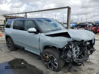 2024 Rivian R1S Adventure with VIN 7PDSGABA7RN038477, listed as a Copart auction lot 48711345 with 0 mi miles and Salvage Title. Bid and sale history available at carsss.com. Image 4.
