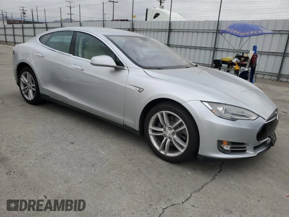 2014 Tesla Model S 60 with VIN 5YJSA1H14EFP34335, listed as a Copart auction lot 65504325 with Not provided miles and Clean title. Bid and sale history available at DreamBid. Image 4.