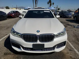 2019 BMW 7 Series 750i with VIN WBA7F0C5XKGM25771, listed as a Copart auction lot 47239195 with 73,691 mi miles and Salvage Title. Bid and sale history available at carsss.com. Image 5.