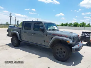 2020 Jeep Gladiator Mojave z VIN 1C6JJTEG3LL202639, wystawiony jako IAAI lot #42239807 z przebiegiem 76 361 mil mil oraz . Historia ofert i sprzedaży dostępna na DreamBid. Obrazek 1.