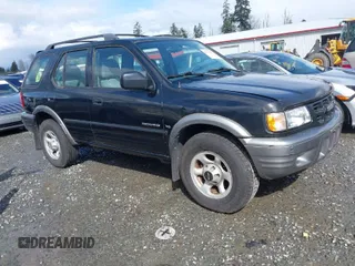 2001 Isuzu Rodeo z VIN 42CK58W9143610580, wystawiony jako IAAI lot #41939199 z przebiegiem 125 754 mil mil oraz . Historia ofert i sprzedaży dostępna na DreamBid. Obrazek 1.