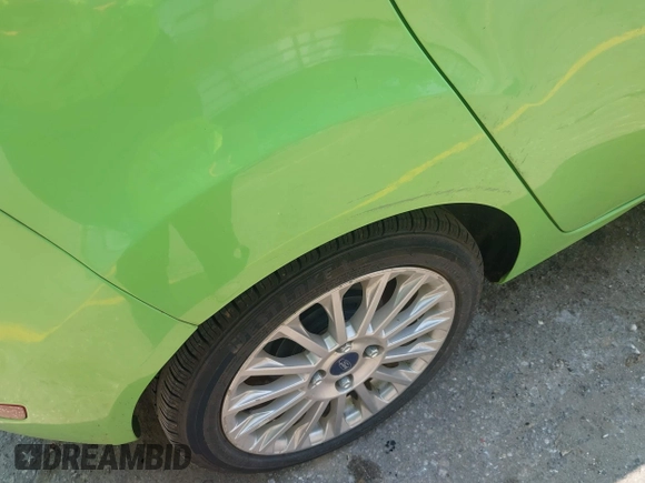 2014 Ford Fiesta Titanium z VIN 3FADP4FJ7EM203322, wystawiony jako IAAI lot #42448840 z przebiegiem 91 901 mil mil oraz . Historia ofert i sprzedaży dostępna na DreamBid. Obrazek 12.