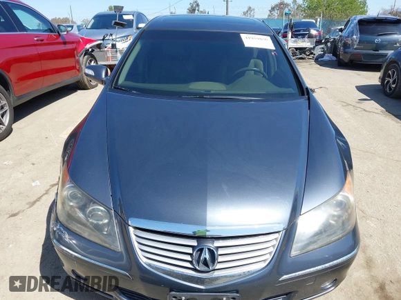 2006 Acura RL z VIN JH4KB16516C004396, wystawiony jako IAAI lot #41959850 z przebiegiem 114 670 mil mil oraz . Historia ofert i sprzedaży dostępna na DreamBid. Obrazek 11.