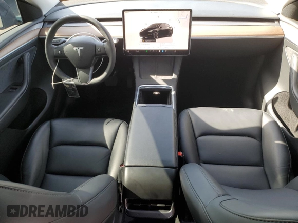 2024 Tesla Model Y with VIN 7SAYGDED0RF131495, listed as a Copart auction lot 56849765 with 10,120 mi miles and Salvage title. Bid and sale history available at DreamBid. Image 8.
