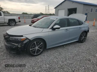 2023 Honda Civic Touring z VIN 2HGFE1F96PH311589, wystawiony jako Copart lot #58594035 z przebiegiem 17 762 mil mil oraz Szkoda całkowita • Salvage title. Historia ofert i sprzedaży dostępna na DreamBid. Obrazek 1.