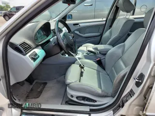 2004 BMW 3 Series 330xi with VIN WBAEW53464PG10935, listed as a Copart auction lot 63155905 with 165,240 mi miles and Clean title. Bid and sale history available at DreamBid. Image 7.