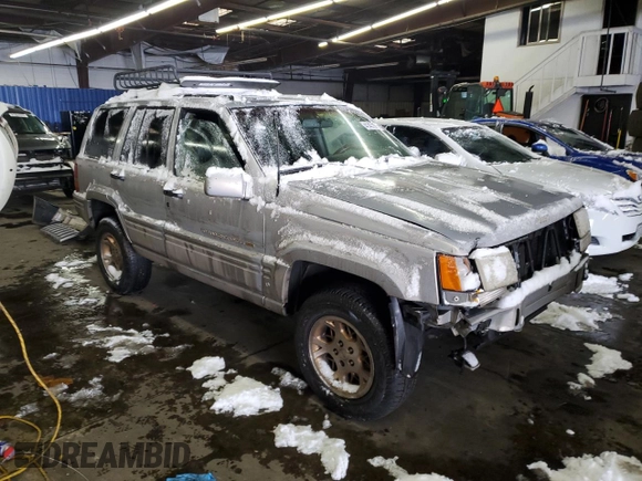 1997 Jeep Grand Cherokee Limited with VIN 1J4GZ78Y1VC706353, listed as a Copart auction lot 41437085 with 163,675 mi miles and Salvage Title. Bid and sale history available at carsss.com. Image 4.
