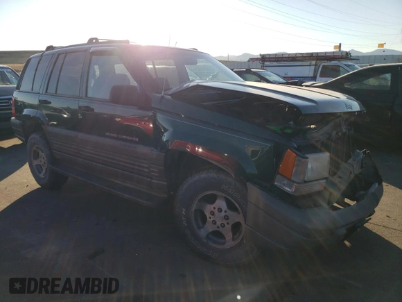 1997 Jeep Grand Cherokee Laredo with VIN 1J4GZ58Y6VC647434, listed as a Copart auction lot 73496824 with 124,946 mi miles and Salvage Title. Bid and sale history available at carsss.com. Image 4.