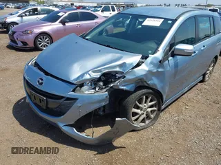 2013 Mazda 5 Touring with VIN JM1CW2CL8D0145628, listed as a IAAI auction lot 42148184 with 137,150 mi miles and . Bid and sale history available at DreamBid. Image 6.