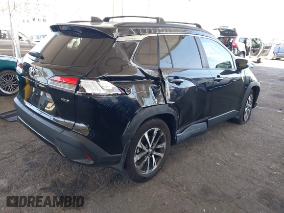 2023 Toyota Corolla Cross XLE with VIN 7MUDAAAG8PV072030, listed as a IAAI auction lot 42397573 with 6,584 mi miles and . Bid and sale history available at DreamBid. Image 4.