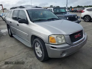 2005 GMC Envoy SLT with VIN 1GKET16S656102004, listed as a Copart auction lot 74543124 with Not Provided miles and Salvage Title. Bid and sale history available at DreamBid. Image 4.