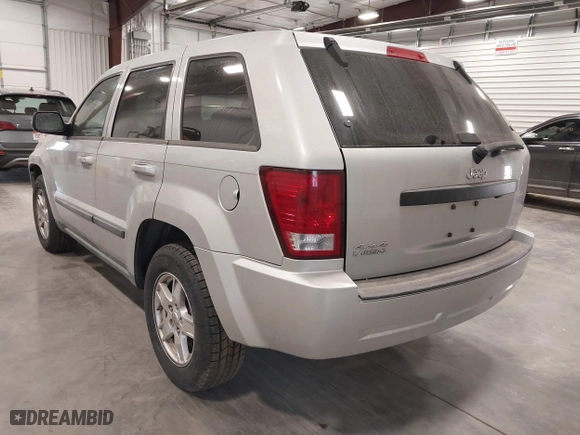 2007 Jeep Grand Cherokee Laredo with VIN 1J8GR48K57C687365, listed as a IAAI auction lot 42038456 with 162,343 mi miles. Bid and sale history available at carsss.com. Image 3.