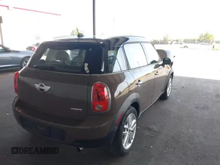 2012 MINI Countryman with VIN WMWZB3C51CWM04563, listed as a IAAI auction lot 42564564 with 95,760 mi miles and . Bid and sale history available at DreamBid. Image 4.