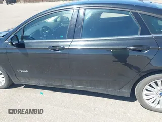 2013 Ford Fusion SE Hybrid with VIN 3FA6P0LUXDR298606, listed as a IAAI auction lot 41976525 with 121,660 mi miles. Bid and sale history available at carsss.com. Image 6.
