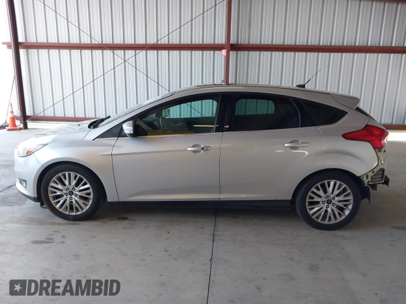 2017 Ford Focus Titanium z VIN 1FADP3N2XHL288103, wystawiony jako IAAI lot #42573844 z przebiegiem 128 952 mil mil oraz . Historia ofert i sprzedaży dostępna na DreamBid. Obrazek 15.