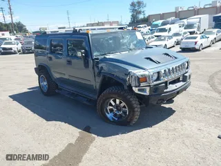 2005 Hummer H2 SUV with VIN 5GRGN23U35H105620, listed as a IAAI auction lot 41912574 with 232,938 mi miles. Bid and sale history available at carsss.com. Image 1.
