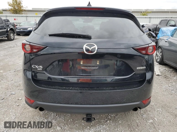 2020 Mazda CX-5 Touring with VIN JM3KFBCM1L0792706, listed as a Copart auction lot 73032144 with 56,845 mi miles and Salvage Title. Bid and sale history available at carsss.com. Image 6.