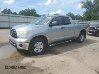 2012 Toyota Tundra with VIN 5TFRM5F10CX050580, listed as a Copart auction lot 60654385 with 215,866 mi miles and Salvage title. Bid and sale history available at DreamBid. Image 1.