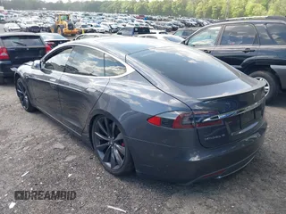 2014 Tesla Model S P85D with VIN 5YJSA1H29EFP63032, listed as a IAAI auction lot 42132145 with Not Provided miles and . Bid and sale history available at DreamBid. Image 3.