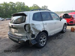 2015 Subaru Forester Touring with VIN JF2SJAWC9FH573973, listed as a IAAI auction lot 42380080 with 87,938 mi miles and . Bid and sale history available at DreamBid. Image 4.