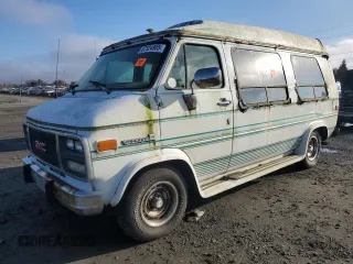 1995 GMC Vandura z VIN 1GDEG25K1SF505970, wystawiony jako Copart lot #87524905 z przebiegiem 130 163 mil mil oraz Tytuł czysty. Historia ofert i sprzedaży dostępna na DreamBid. Obrazek 1.