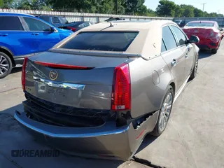 2012 Cadillac CTS Luxury z VIN 1G6DF5E58C0142041, wystawiony jako IAAI lot #42235864 z przebiegiem 59 697 mil mil oraz . Historia ofert i sprzedaży dostępna na DreamBid. Obrazek 4.